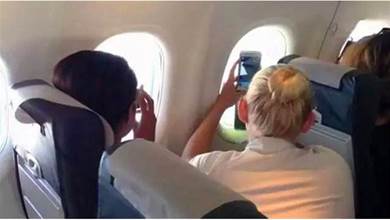 飛機在一萬英呎高空，女乘客拿手機拍下窗外風景卻目睹驚人事件全紀錄